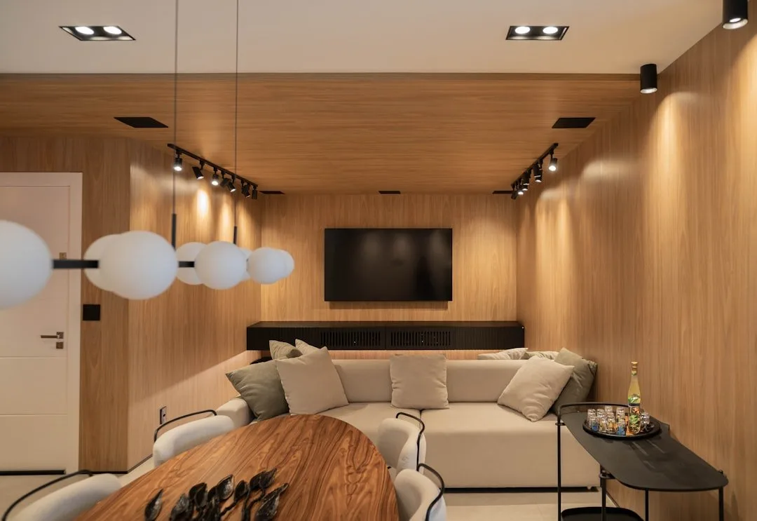 Remote control smart light bulb next to a handheld remote